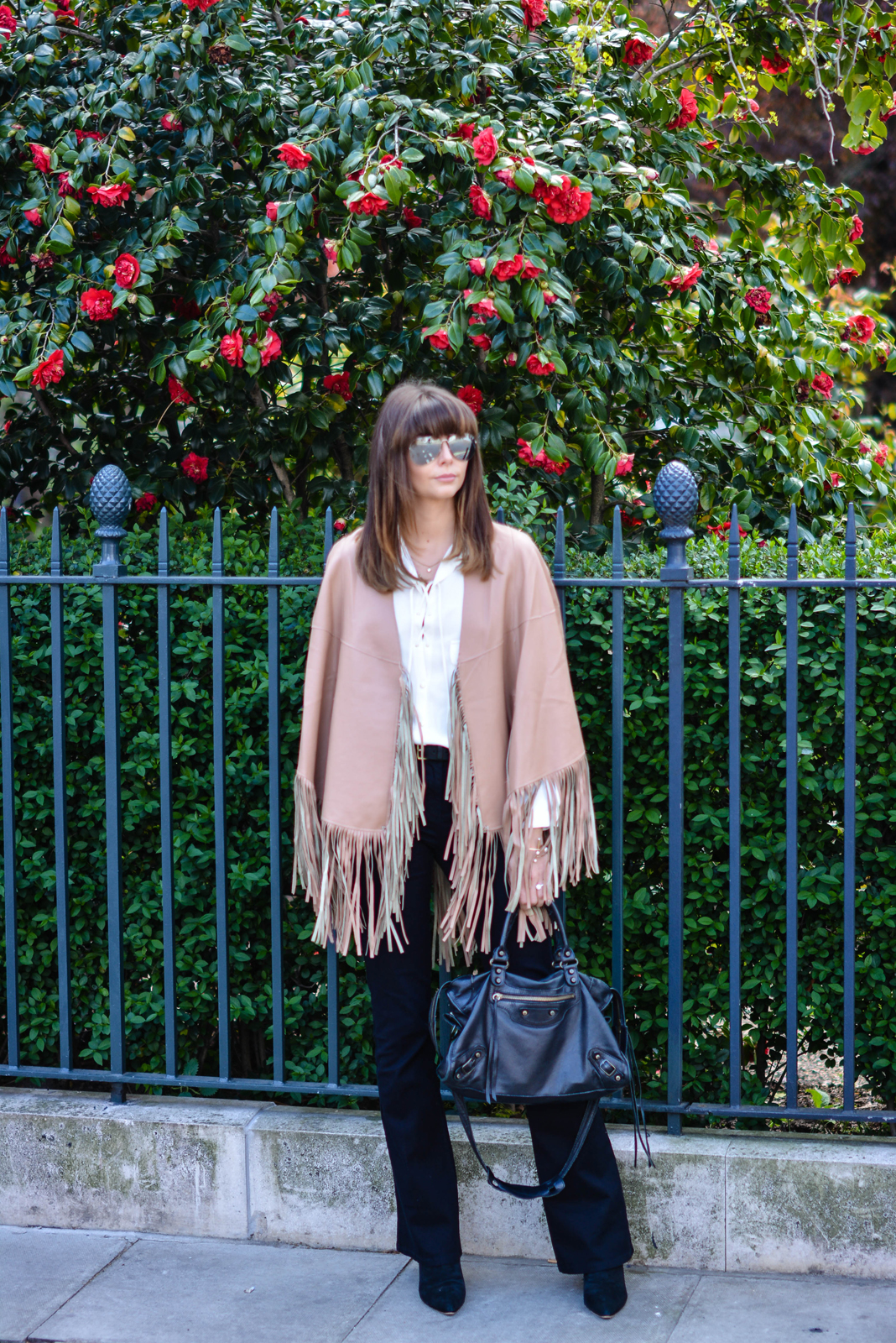 EJSTYLE - Emma Hill, Romwe nude leather fringe poncho cape, Black Next flare jeans, Balenciaga bag, Zara lace up tie shirt, polarised aviator sunglasses, OOTD, 70's trend