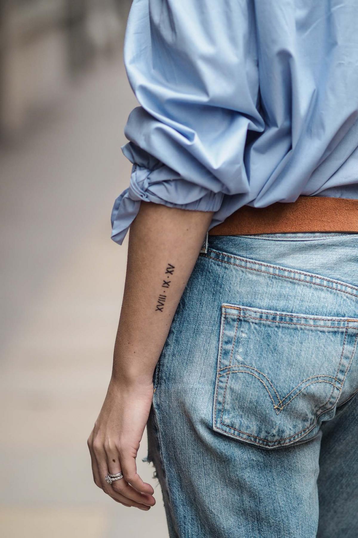 wedding date arm tattoo roman numerals