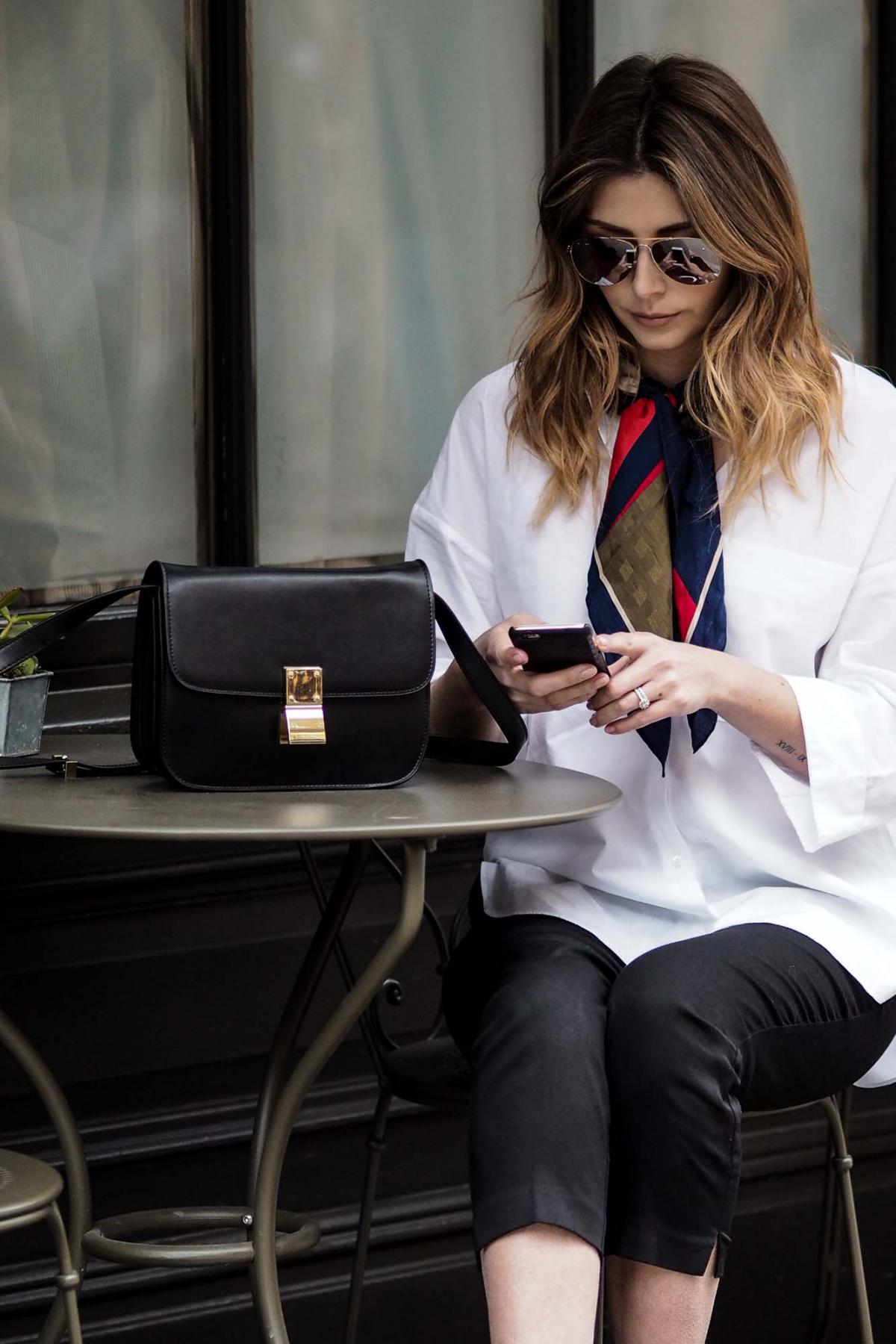 black celine box bag, white shirt, silk scarf tied around the neck