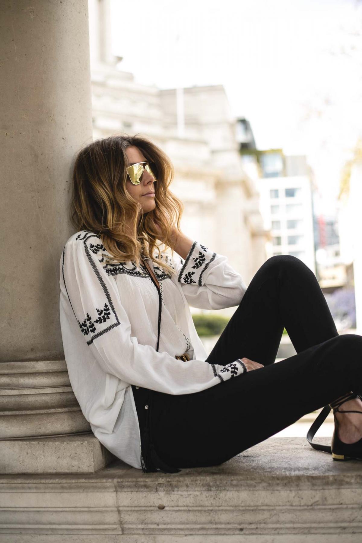 embroidered boho blouse, black jeans, gold mirrored sunglasses