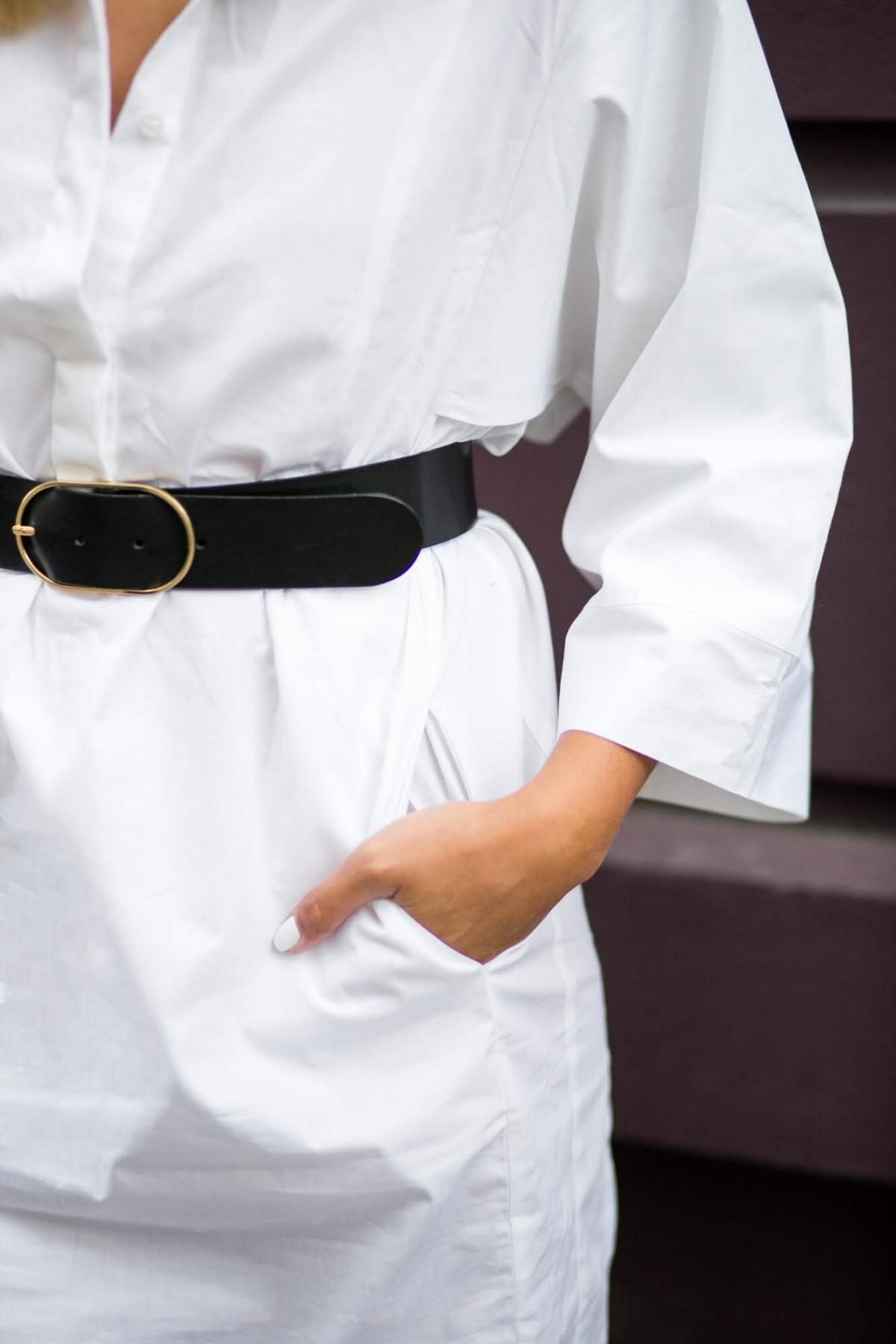 White shirt dress store with black belt