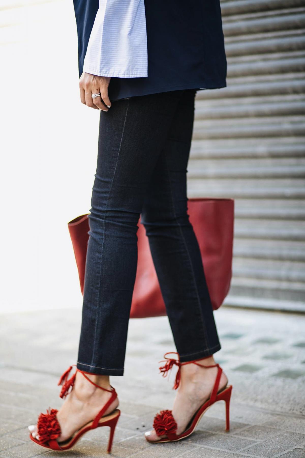 Wallis indigo straight leg jeans, red leather Saint Laurent shopper tote bag, blue pinstripe wide cuff shirt