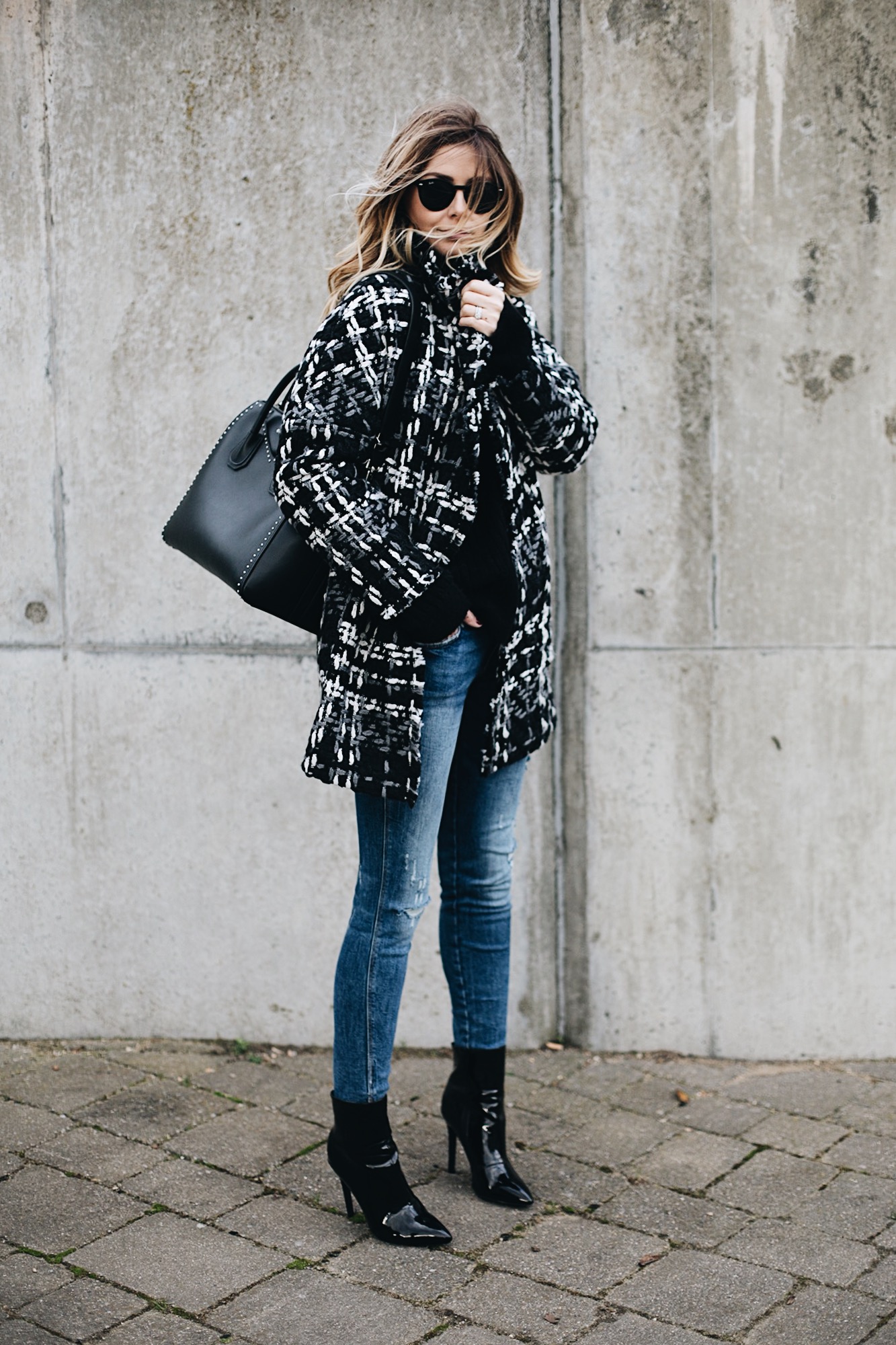 monochrome winter coat, black Givenchy studded Antigona bag medium, ripped skinny jeans, vinyl patent black heeled ankle boots, chic winter outfit