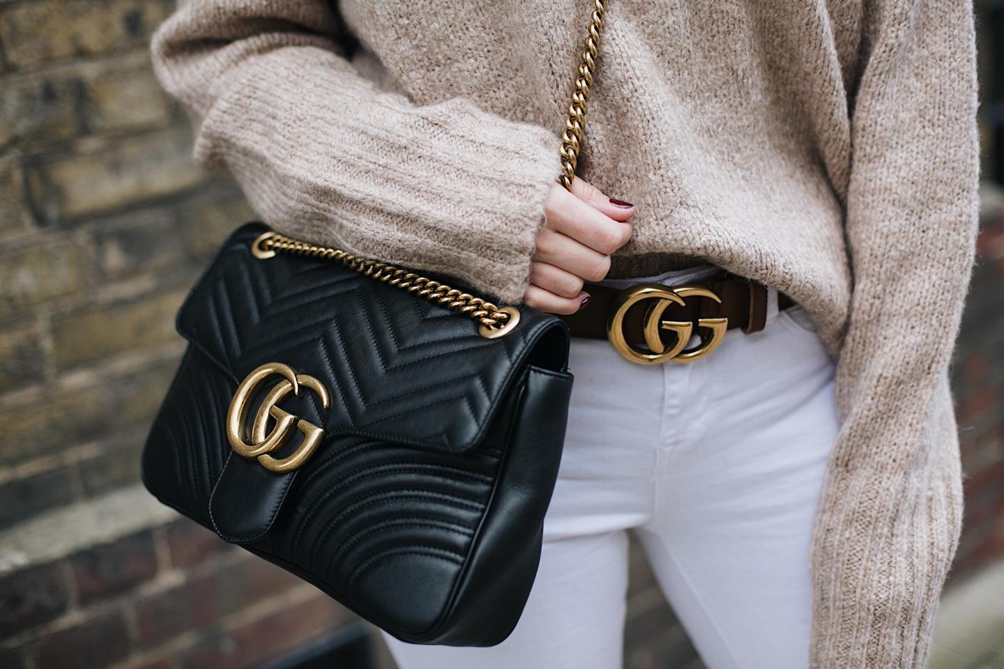 Beige knit, Tan Gucci marmot GG belt, Black leather medium Gucci Marmont bag, white skinny jeans