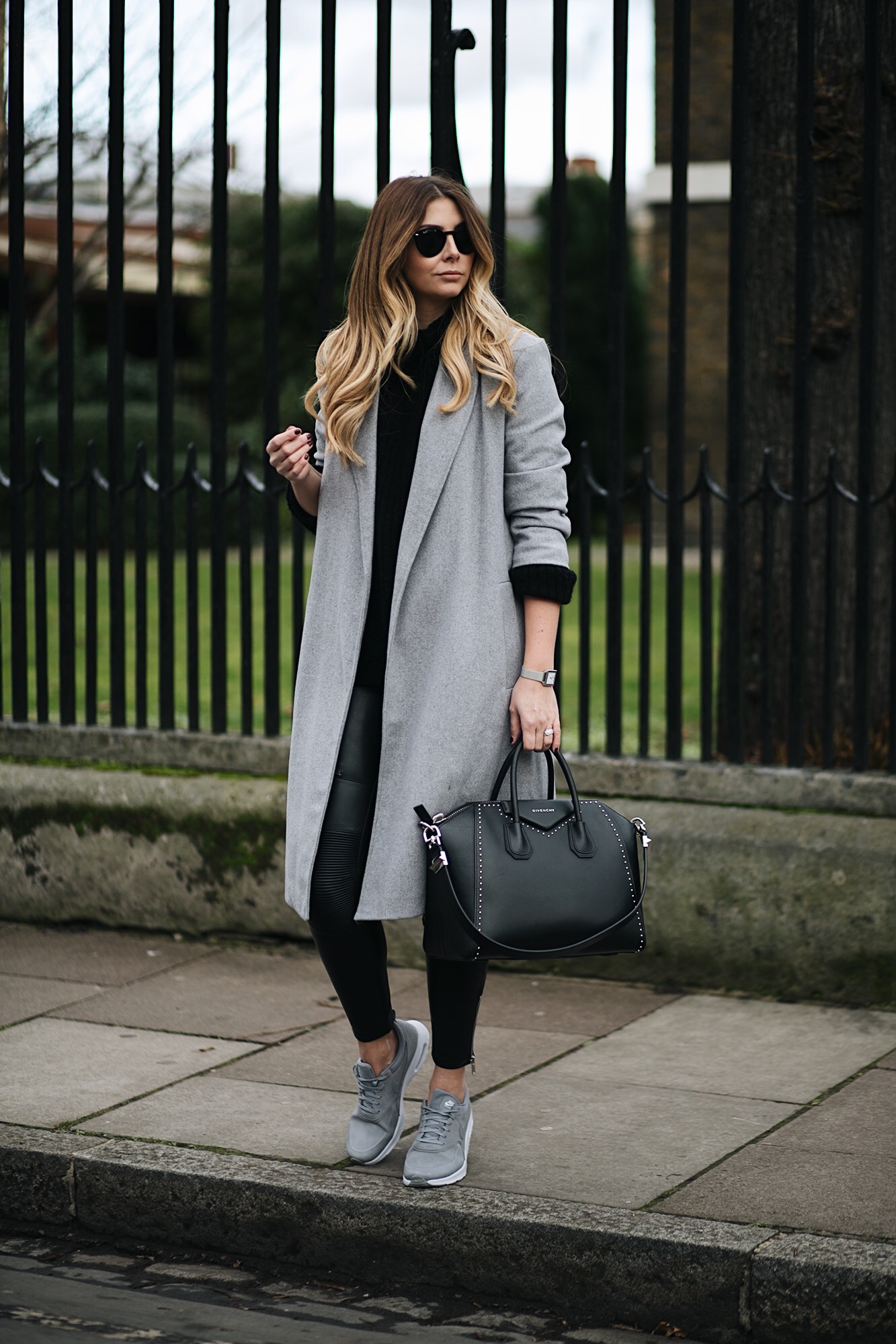 grey swing coat, leather look biker trousers, grey Nike Thea trainers, Givenchy Antigona, sports luxe winter outfit