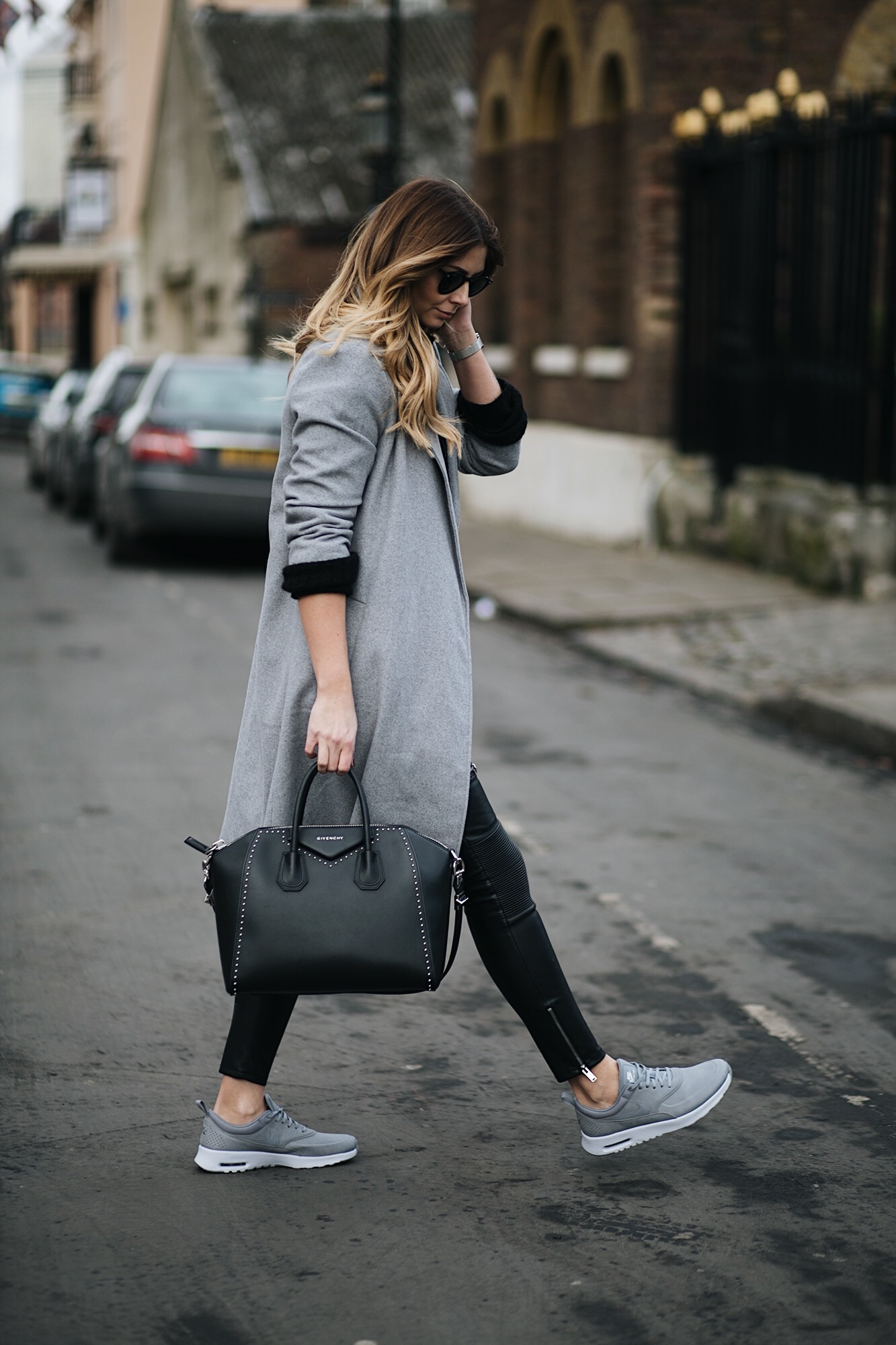 grey swing coat, leather look biker trousers, grey Nike Thea trainers, Givenchy Antigona, sports luxe winter outfit
