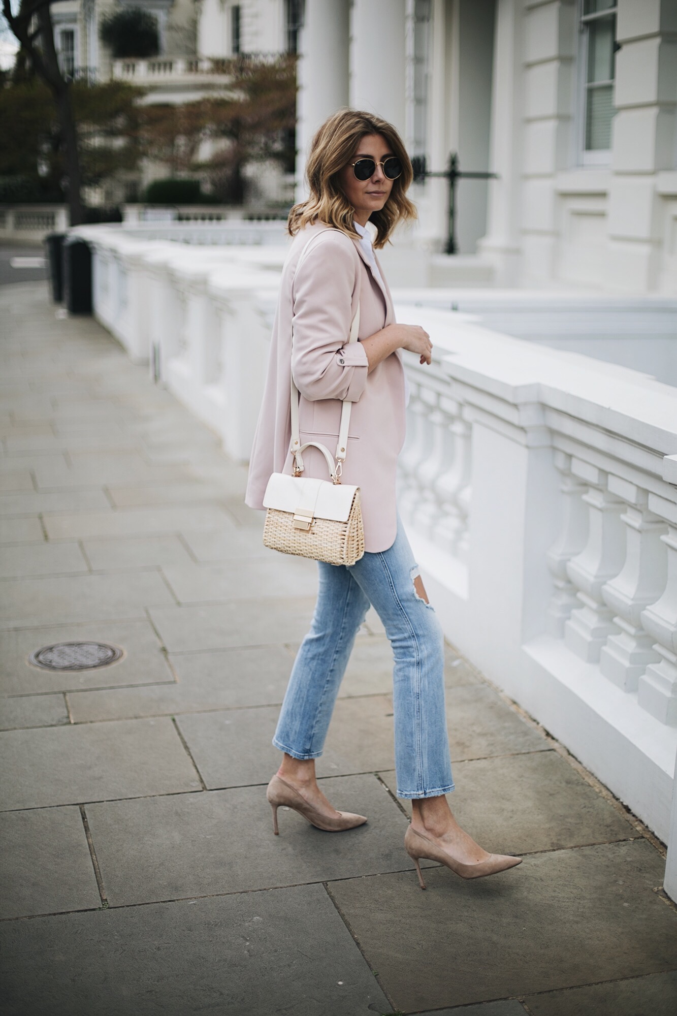Emma Hill wears nude blazer, white linen shirt, bleach ripped cropped flare jeans, 50's style basket bag, beige suede Jimmy Choo court shoes, chic spring outfit