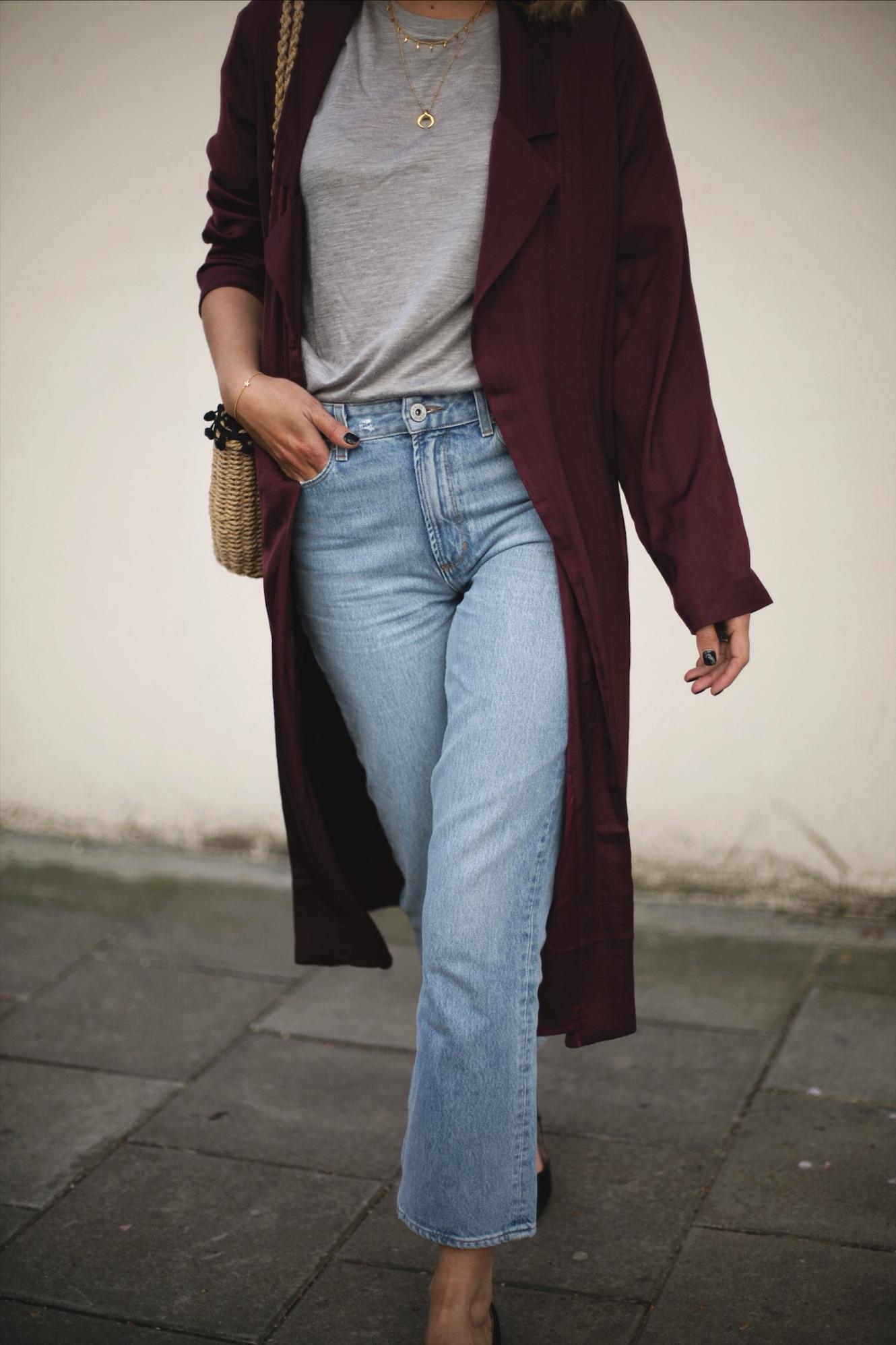 Emma Hill wears deep purple wine silky duster jacket kimono, straw basket bag with pom pom detail, cropped frayed hem jeans, Dune x Rupert Sanderson low block heels, outfit ideas for Spring