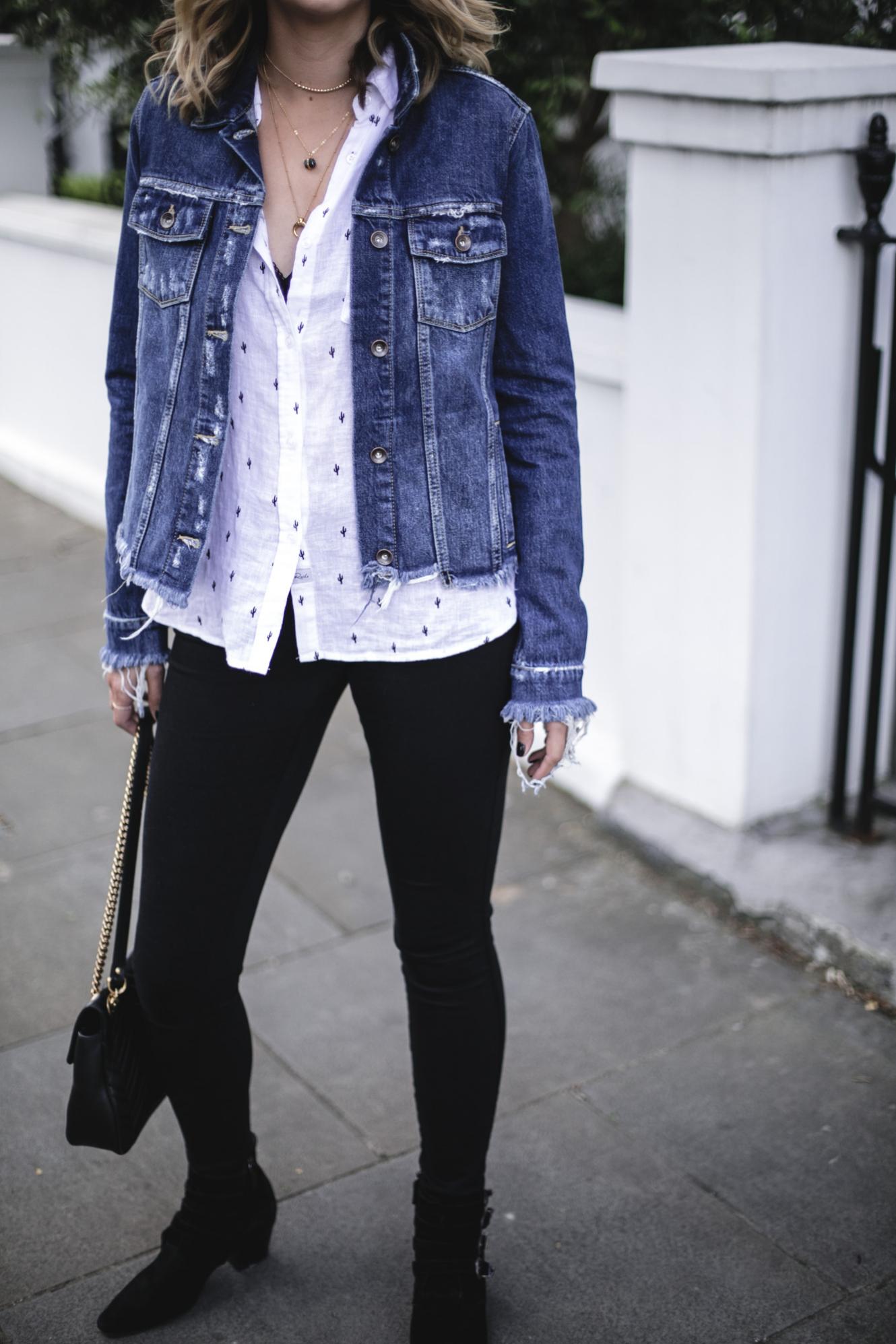 Emma Hill wears Paige frayed denim jacket, Rails white linen cactus print shirt, black skinny jeans, Gucci marmont bag, black buckle ankle boots, casual Spring outfit