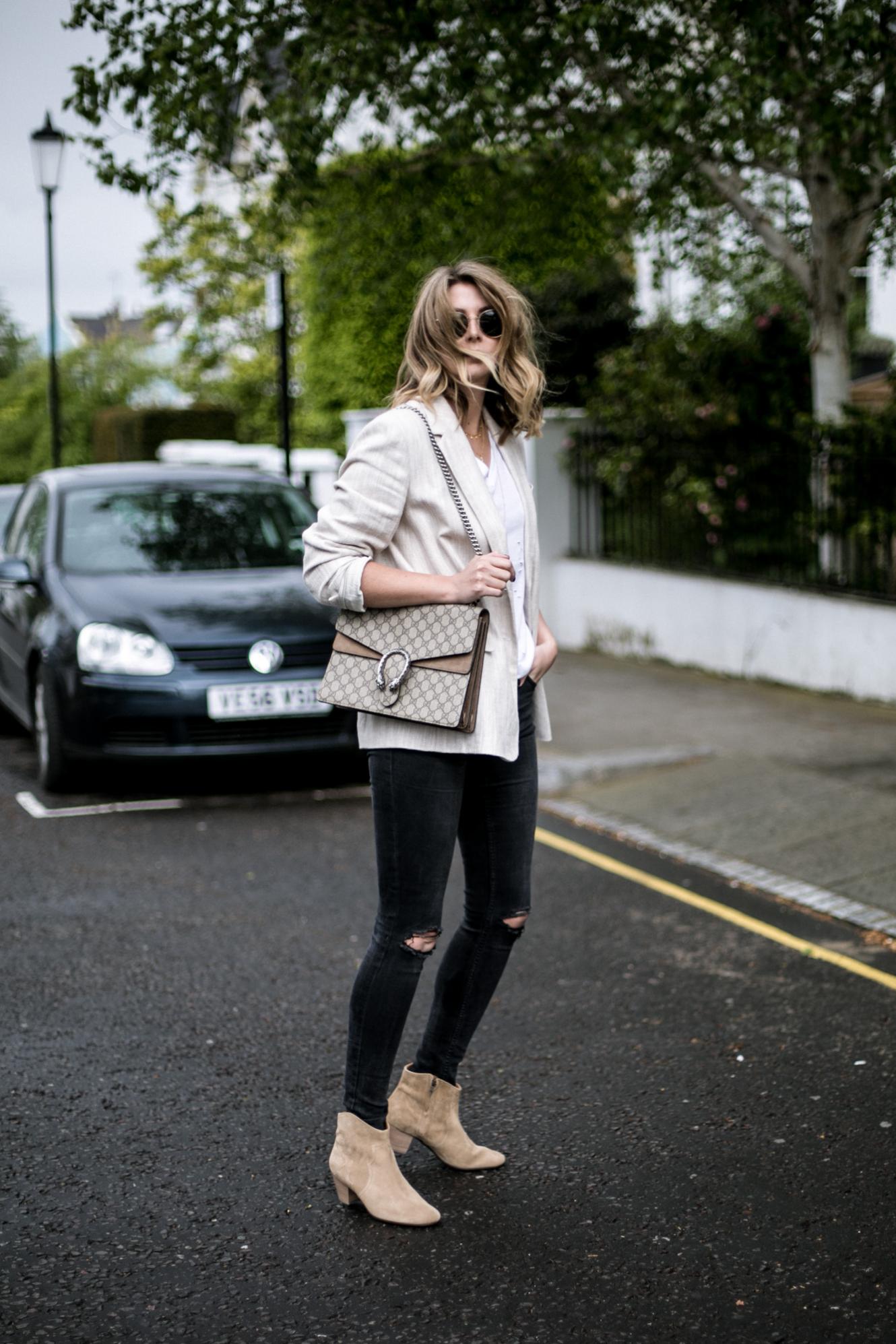 Emma Hill of EJSTYLE wears beige linen blazer, white t-shirt, Gucci Dionysus bag, black skinny jeans ripped knees, beige suede Isabel marant dicker boots, chic Spring outfit