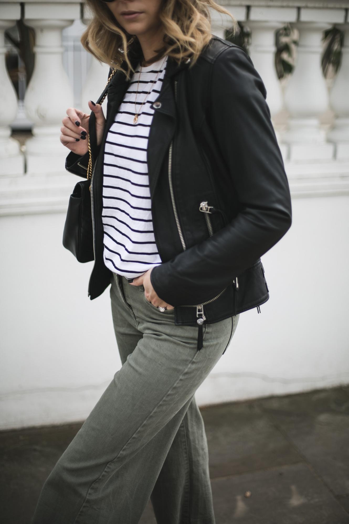 Emma Hill of EJSTYLE wears black leather biker jacket, stripe t-shirt, wide leg khaki trousers, Gucci Marmont bag Emma Hill of EJSTYLE wears black leather biker jacket, stripe t-shirt, wide leg khaki trousers, Gucci Marmont bag