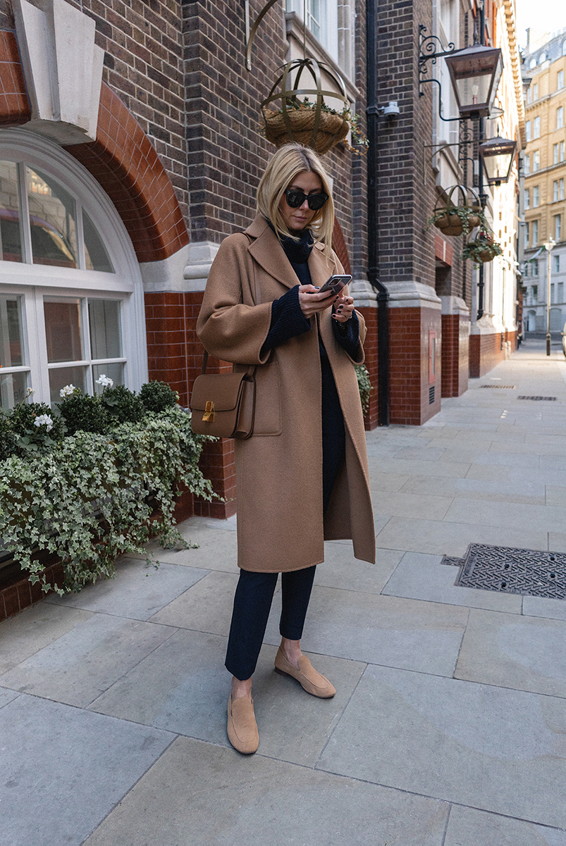 Emma Hill style. Camel The Curated cashmere wool coat, Céline classic bag leige leather, navy jumper, smart trousers, tan suede loafers, smart chic workwear outfit autumn winter fall_