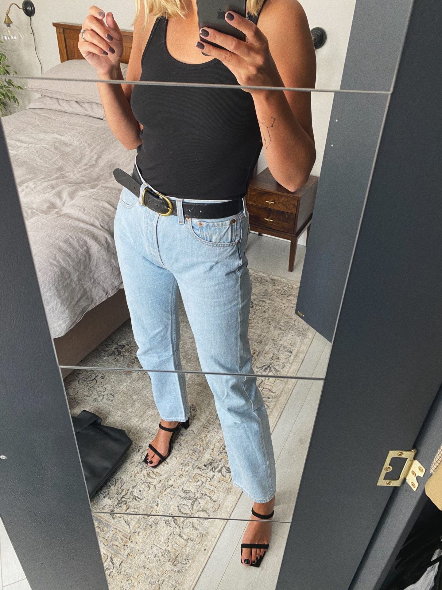 Emma Hill basic style. Vintage Levi’s 501 straight leg jeans, black vest top, black 90’s strappy sandals